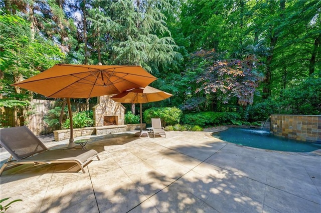 1255 Beech Haven Rd NE, Atlanta, GA 30324 - view of patio / terrace featuring an outdoor stone fireplace and an outdoor pool