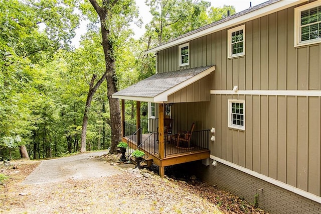 view of side of home featuring a porch