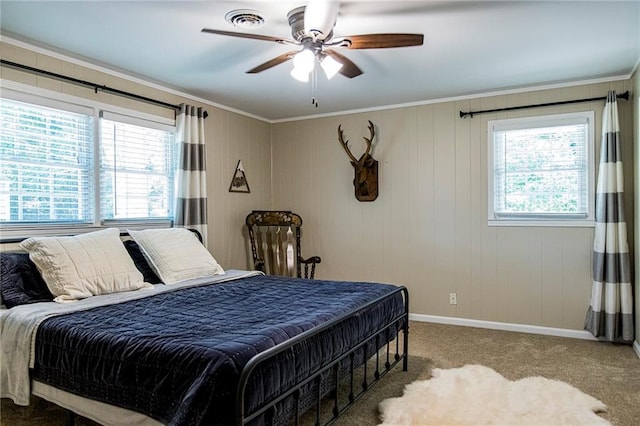 bedroom featuring crown molding, ceiling fan, and carpet floors