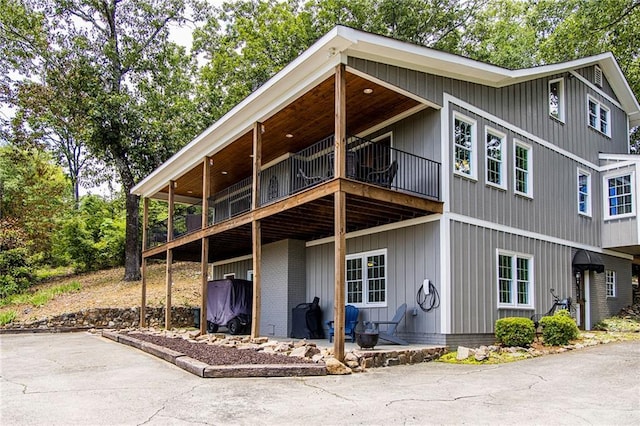 rear view of house with a balcony