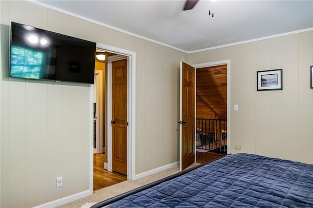 unfurnished bedroom featuring crown molding, carpet floors, and ceiling fan