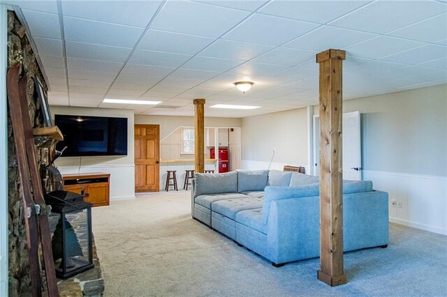 kitchen with hanging light fixtures, wood-type flooring, stainless steel dishwasher, and a healthy amount of sunlight