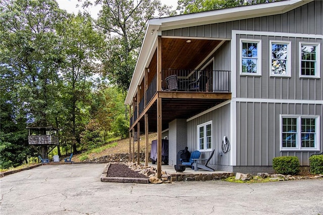 view of property exterior with a balcony