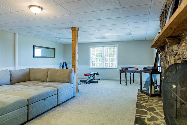 carpeted living room with a drop ceiling