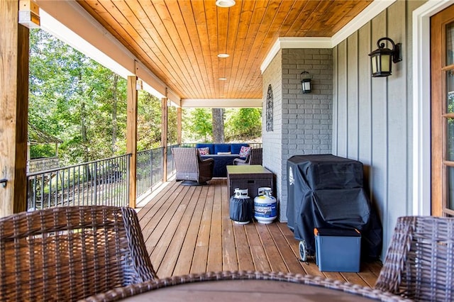 wooden deck featuring an outdoor living space