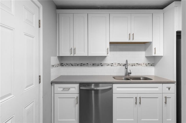 kitchen with dishwasher, tasteful backsplash, white cabinetry, and a sink