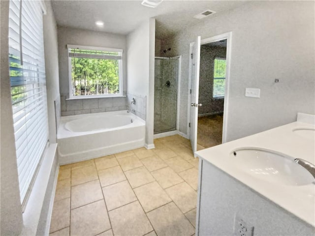 bathroom with vanity, tile patterned floors, and separate shower and tub