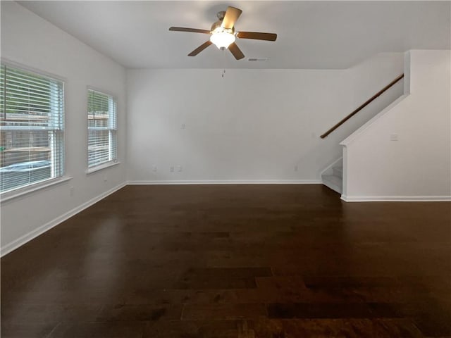3513 Lakeview Crk, Lithonia, GA 30038 - unfurnished living room featuring a ceiling fan, visible vents, dark wood finished floors, stairway, and baseboards
