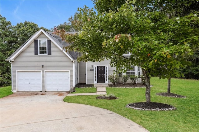 view of front facade featuring a front yard and a garage