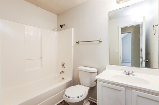 full bathroom with vanity, toilet, and washtub / shower combination