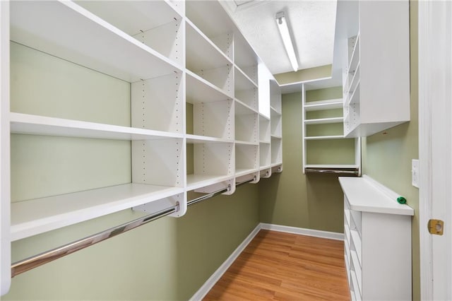 spacious closet with light wood-style flooring