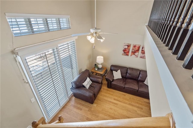 living area featuring ceiling fan and wood finished floors