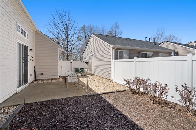 view of yard with a patio and a fenced backyard