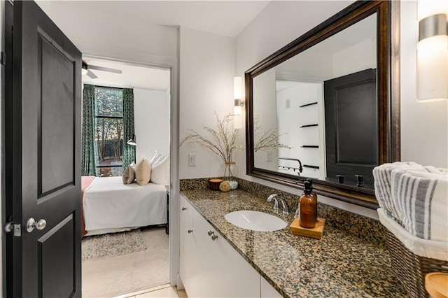 bathroom featuring a ceiling fan and vanity