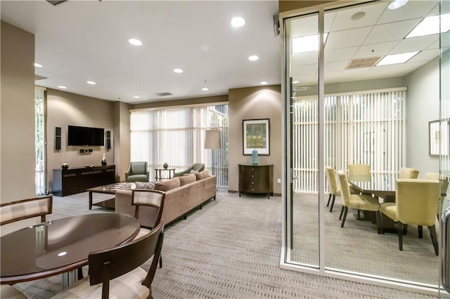 interior space featuring recessed lighting, light colored carpet, and visible vents