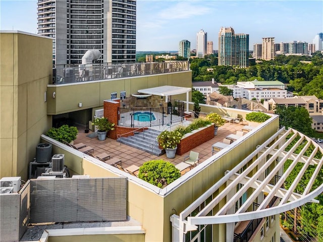 balcony featuring a patio area and a city view