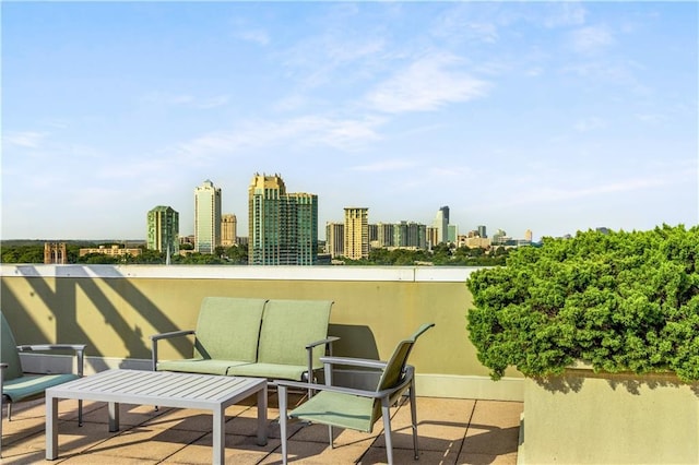 view of patio / terrace featuring a city view