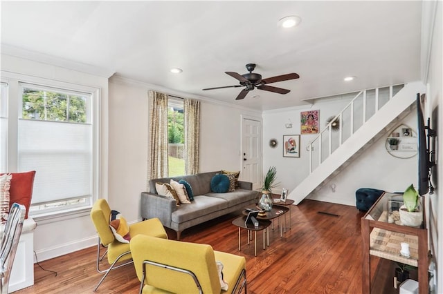 living area featuring stairway, recessed lighting, wood finished floors, and ornamental molding