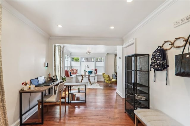 interior space featuring recessed lighting, ornamental molding, baseboards, and wood finished floors