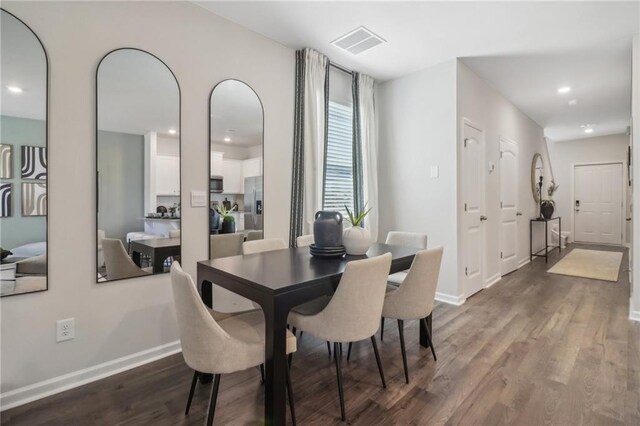 dining area featuring recessed lighting, visible vents, baseboards, and wood finished floors