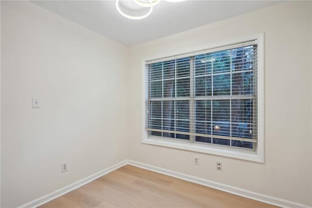 spare room with hardwood / wood-style flooring