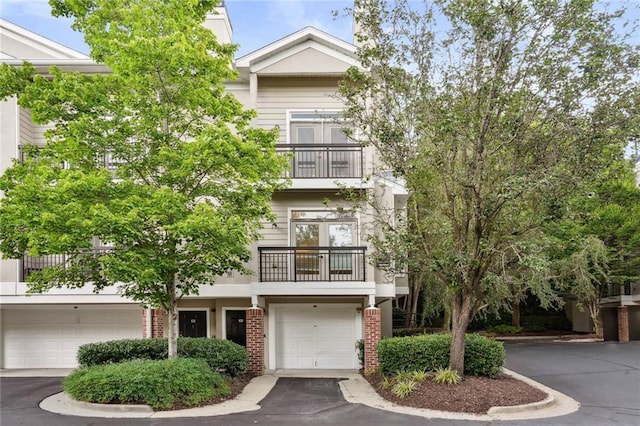 4254 River Green Dr NW Unit 616, Atlanta, GA 30327 - view of front facade featuring brick siding and a balcony