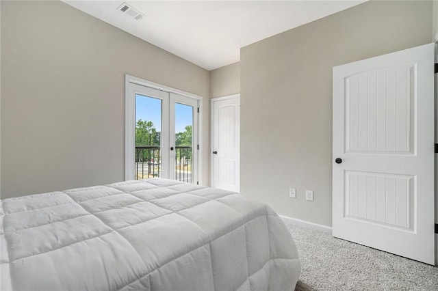 carpeted bedroom with access to outside, visible vents, baseboards, and french doors