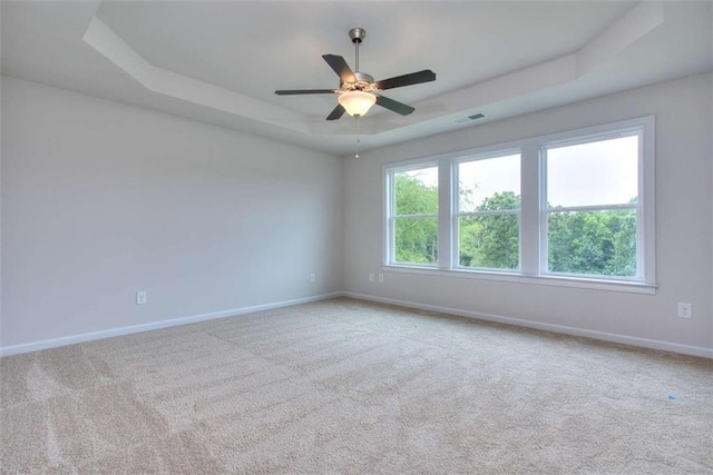 46 Cooper Dr, Mansfield, GA 30055 - carpeted empty room featuring a tray ceiling and ceiling fan