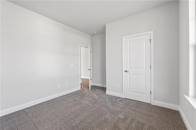 46 Cooper Dr, Mansfield, GA 30055 - unfurnished bedroom with carpet floors and baseboards