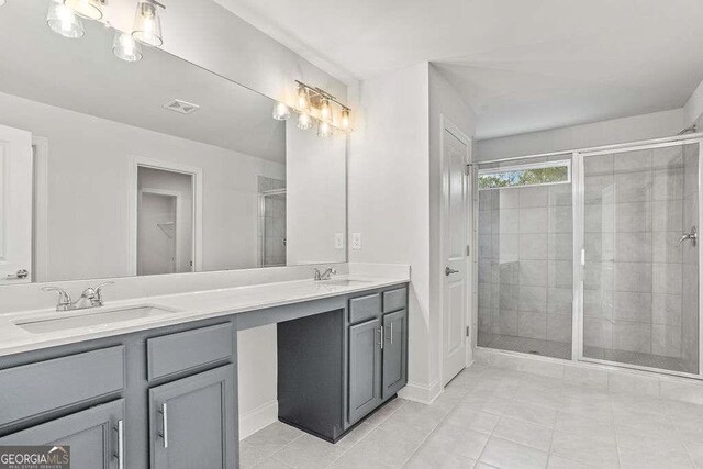 46 Cooper Dr, Mansfield, GA 30055 - full bath featuring double vanity, a shower stall, and tile patterned flooring