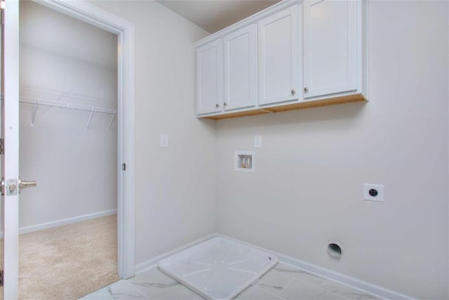 46 Cooper Dr, Mansfield, GA 30055 - laundry room with hookup for an electric dryer, washer hookup, cabinet space, and marble look tile flooring