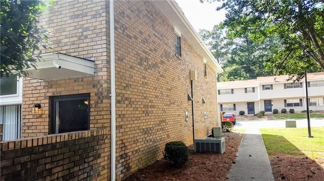 view of side of home featuring a yard