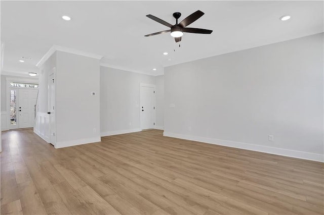 unfurnished living room with ceiling fan, light wood-style flooring, and baseboards