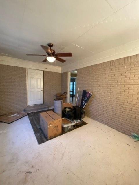 interior space with brick wall and concrete flooring