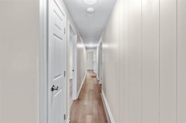 hallway with light wood-type flooring