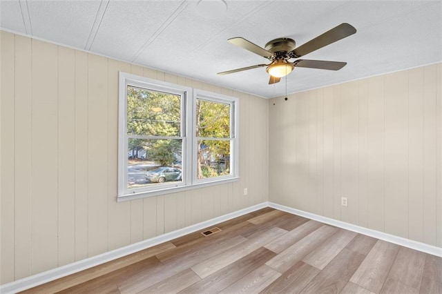 610 Ash Ln, Monroe, GA 30655 - spare room featuring a ceiling fan, visible vents, wood finished floors, and a textured ceiling