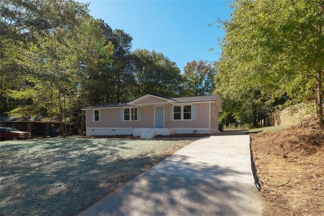 610 Ash Ln, Monroe, GA 30655 - manufactured / mobile home with a porch, driveway, and crawl space