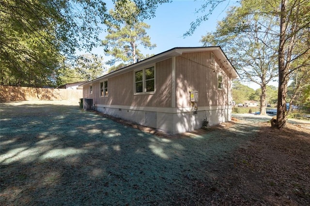 view of property exterior with central AC