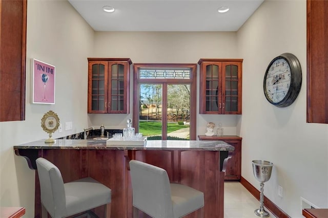 bar with baseboards and recessed lighting