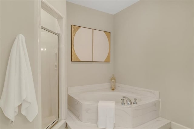 full bathroom featuring a stall shower and a bath