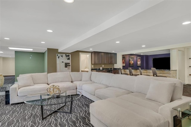 living room featuring recessed lighting and indoor wet bar