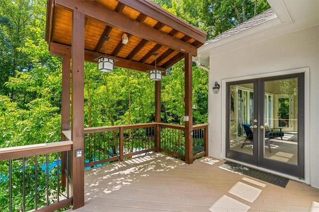 wooden deck featuring french doors