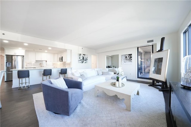 living room with dark hardwood / wood-style floors