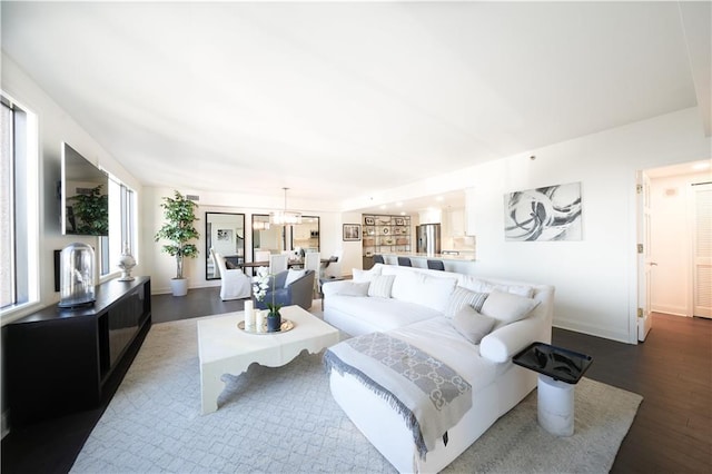 living room with dark hardwood / wood-style floors