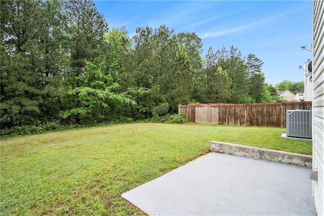 view of yard with cooling unit, a patio area, and fence