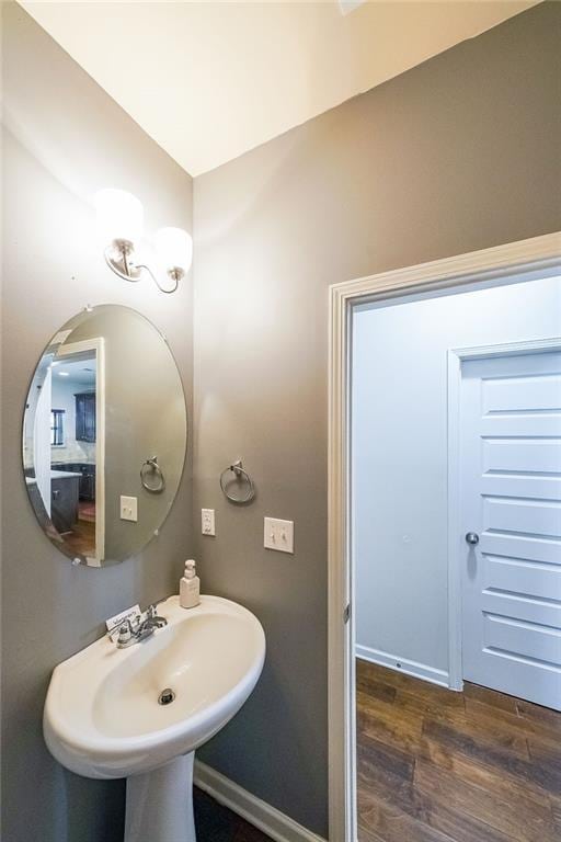 bathroom with hardwood / wood-style floors and sink