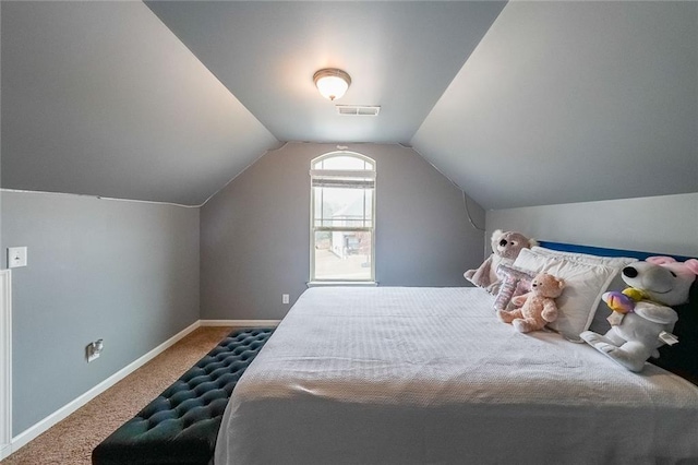 bedroom featuring carpet flooring and vaulted ceiling