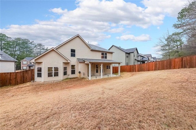 back of house with a patio area