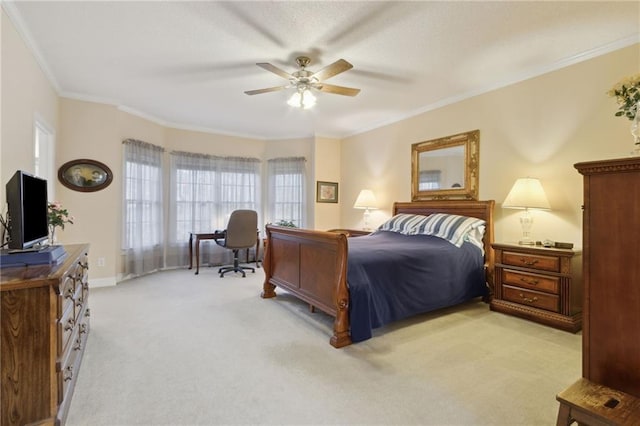 bedroom with ceiling fan, baseboards, light colored carpet, and ornamental molding