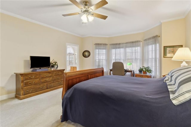 bedroom featuring a ceiling fan, baseboards, carpet, and crown molding